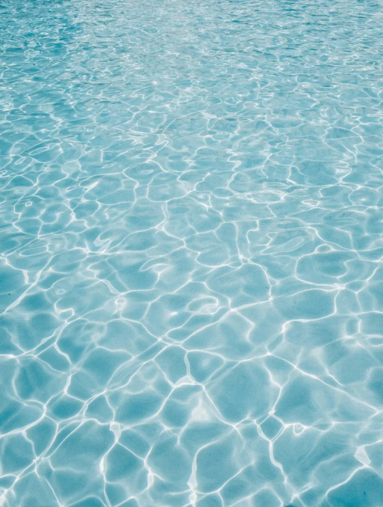 Sunlit turquoise water with rippling reflections